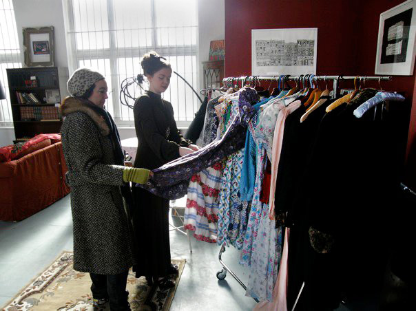 naomi11 Thompson helps a woman pick out vintage dresses at the Parlour. Via the Vintage Secret Facebook page.