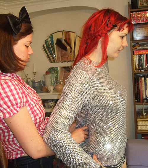 naomi7 Thompson helps the frontwoman of Gabby Young and Other Animals adjust the fit of a top. Via Gabby Young's Style Blog.