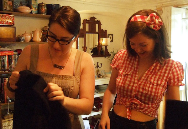 naomi8 Thompson, right, selects clothes for Young to try out. Via Gabby Young's Style Blog.