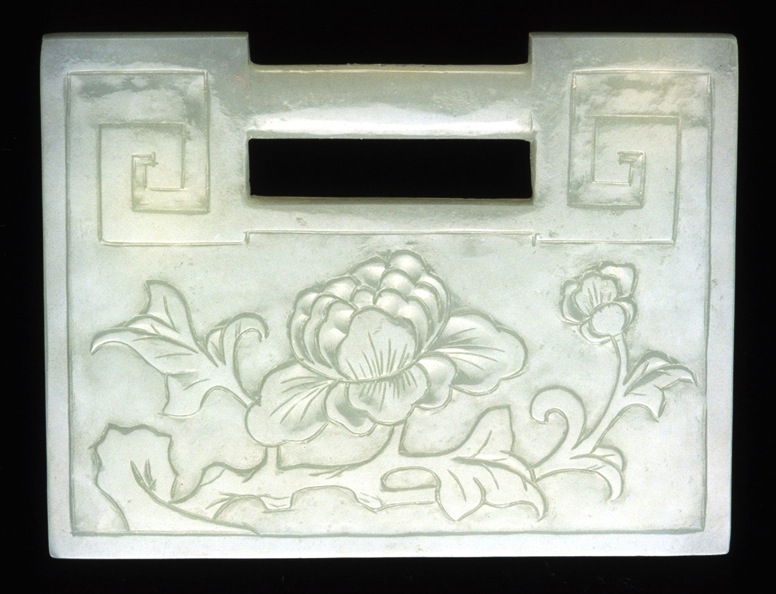 Lock Carved nephrite lock pendants such as this one from the 19th century were given to infant boys to protect them. The peony is a symbol of wealth.
