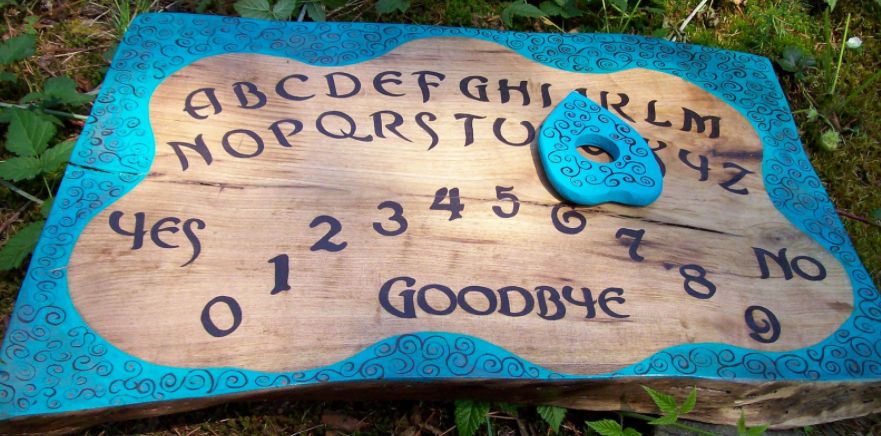 oujiboard Top: The paranormal investigator selling this porcelain doll says it contains the spirit of a 9-year-old girl who was hanged as a witch in England, and it has been recorded saying, "not me." Above: The seller who handmade this Ouija from a 150-year-old walnut tree says it holds the tree's spirit.
