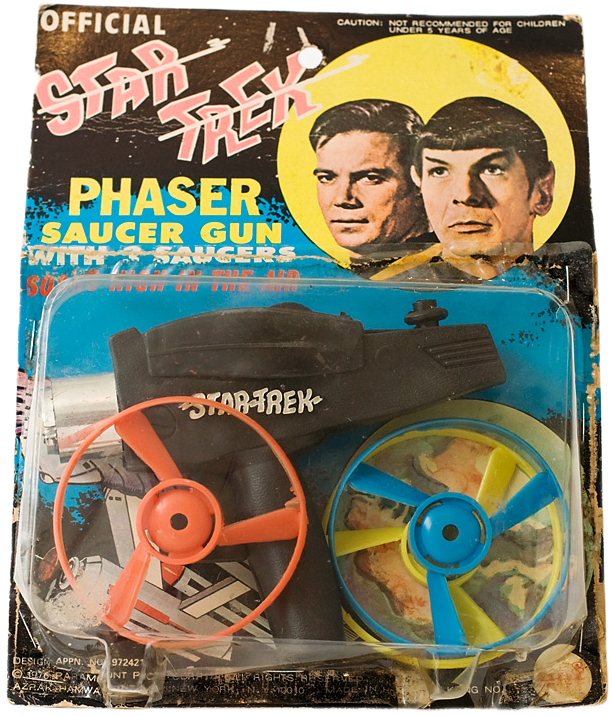 star_trekgun This AHI "Official Star Trek Phaser Saucer Gun" combines the TV show's recognizable weapon with a common style rack toy. Image via startrek.com.