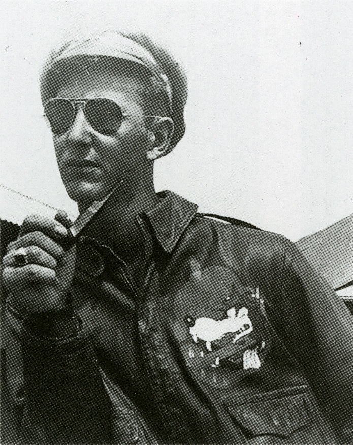 wolf2 Flight officer Robert J. Meer in Lipa, Philippines, with the "Glider Wolf" insignia of the 1st Glider Provisional Group painted on the front of his A-2.