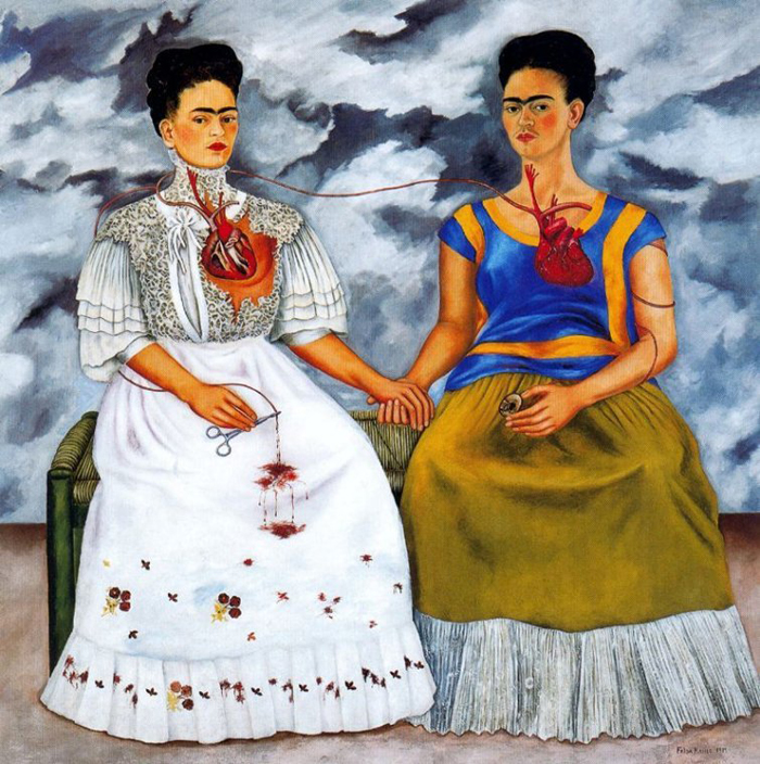 The Two Fridas In Kahlo's painting "Las Dos Fridas" from 1939, she is shown wearing both the Tehuana and European fashions, which both completely conceal her injured leg.