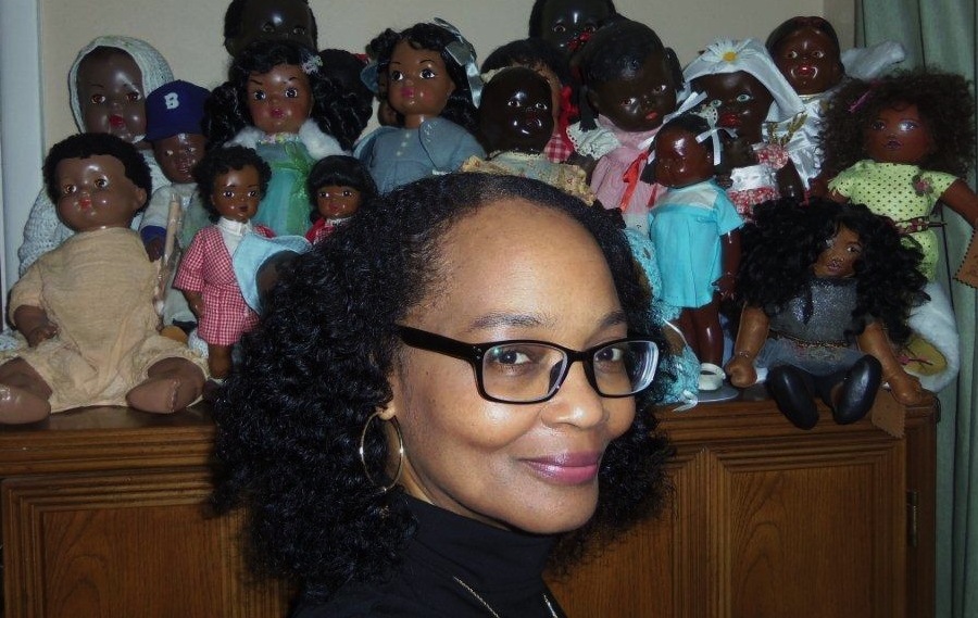 Deb_with_Vintage_to_Modern_Dolls Debbie Behan Garrett poses with a group of vintage to modern dolls.