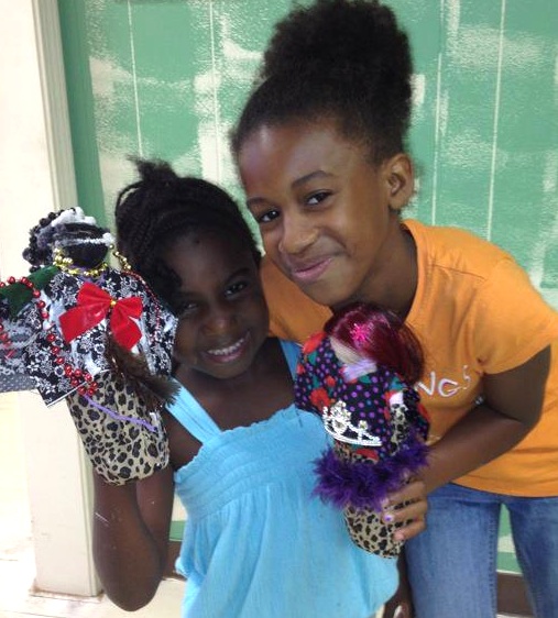 wrapdoll3 Two girls visited the National Black Doll Museum in Mansfield, Massachusetts, in August 2012 to show off the wrap dolls they made. Via the National Black Doll Museum Facebook page.