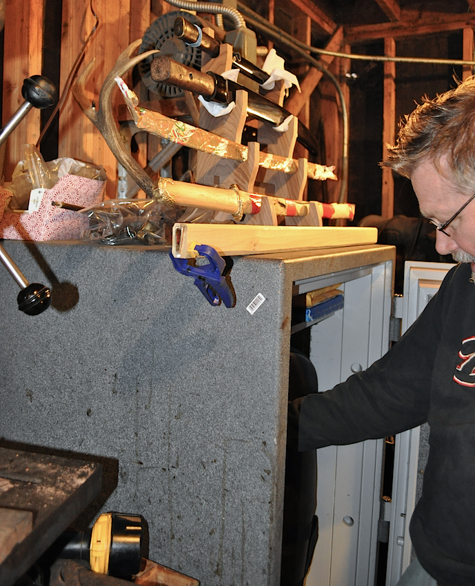 BoydInSafe Above: Boyd reaching into one of the safes in his fortified workshop. Some repair jobs sit on top of the safe. Top: Boyd's favorite sword is similar to one that made an impression on him in the basement of The Met at the age of 17.