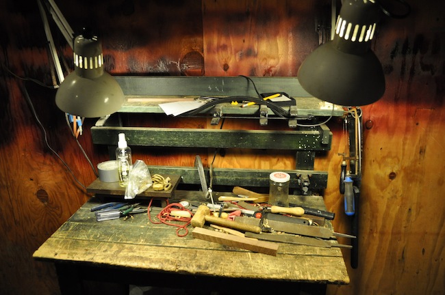 Workbench A table in Boyd's workshop, where he does finish work.