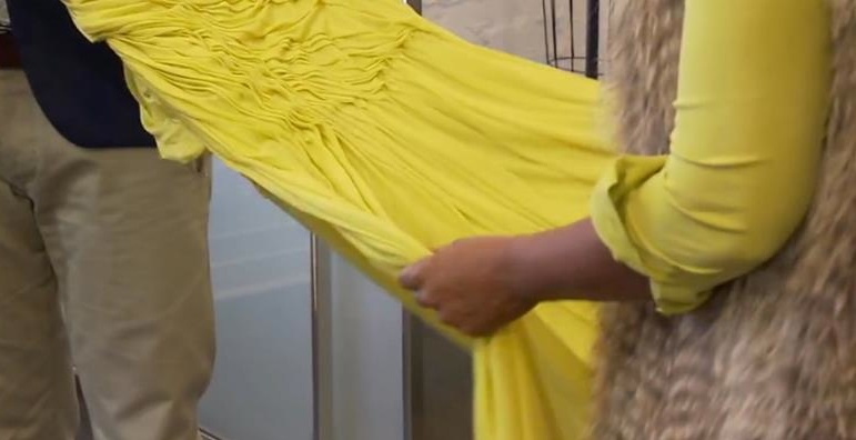 fashion_galanos Christos Garkinos, co-owner of Decades, shows actress Garcelle Beauvais, star of "NYPD Blue," a ruched 1960s Galanos gown. Via Bravo TV.