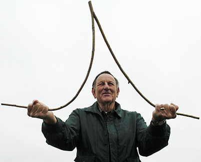 ManDivining Palms-up is the standard way to hold a dowsing stick.