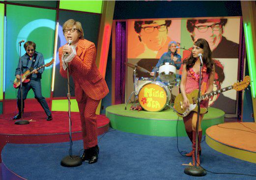 MingPerforming Top: Matt Eichen, reflected in a mirror-top Spaceranger. Above: Ming Tea, performing "Daddy Wasn't There" in the 2002 hit "Austin Powers in Goldmember."