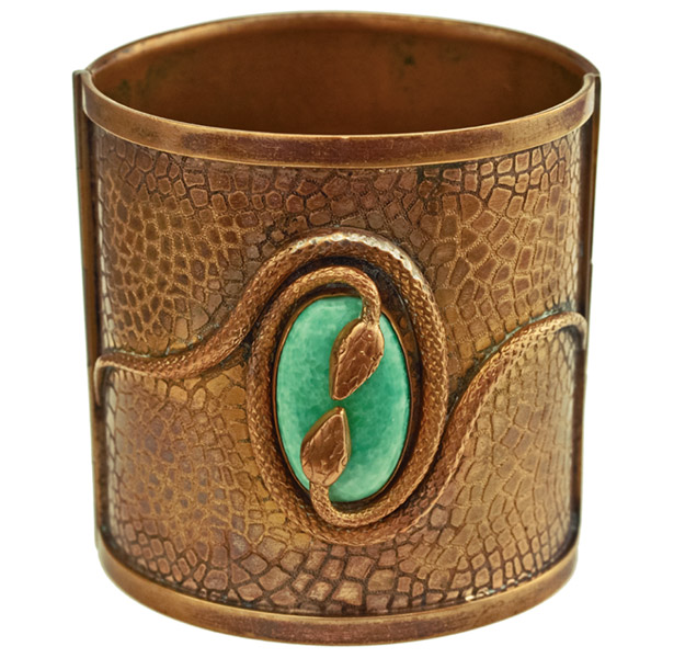 20s_napier1 The discovery of King Tut's tomb inspired the Egyptian Revival style, which Napier adapted with this rare 1920s brass hinged cuff bracelet with a green glass cabochon and double snake motif. (From "The Napier Co.," courtesy of Leslie Burke)