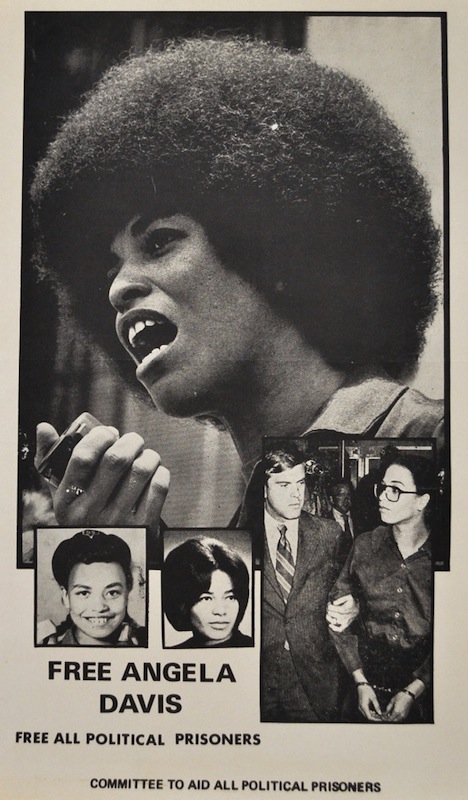 AngelaWithMicSm The most reproduced photograph of Angela was the one of her holding a microphone at a rally in the spring on 1970. It was reproduced on page 24 of a "Life" magazine cover-story article, published on September 11, 1970, and titled "The Making of a Fugitive." The photographer is unknown.