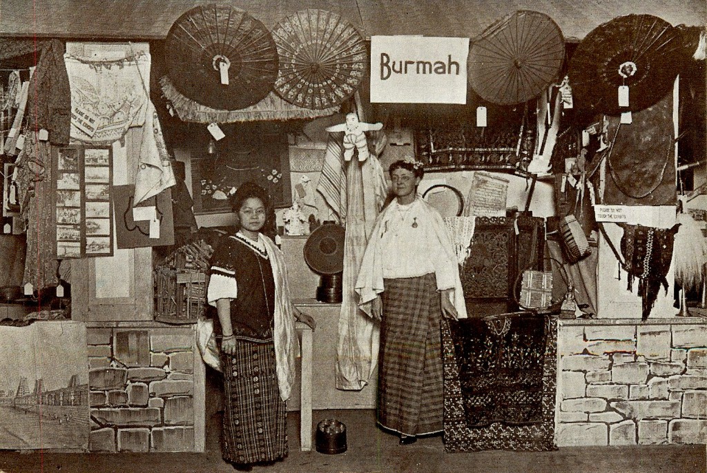 burma_postcard A souvenir postcard show two women wearing native dress in the Burma Court section of 1911's missionary exposition "The World in Boston."