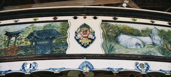 GoldenGate52_HS1914 The rounding boards on the 1914 Herschell-Spillman carousel at Golden Gate Park in San Francisco have landscapes, as well as theatrical shields. (© Aaron Shepard, via carousels.org)