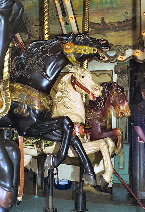 griffithPk0597_035_1926 In the 1920s, sales agents like Ross A. Davis, starting selling carousels pieced together with animals from different makers. The 1926 merry-go-round at Griffith Park in Los Angeles is an example; this row as two Looff horses and one Spillman Engineering. (© Jean Bennett, via carousels.org)