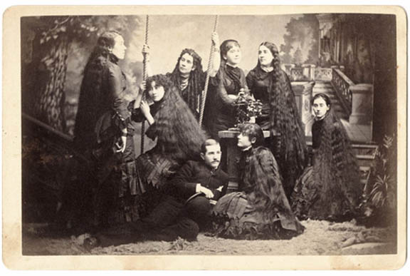 SutherlandSistersBarnum-1 A Barnum and Bailey's publicity shot of the sisters with a young man, perhaps Naomi's husband Harry Bailey, or their brother, Charles. (Via Peachridge Glass)