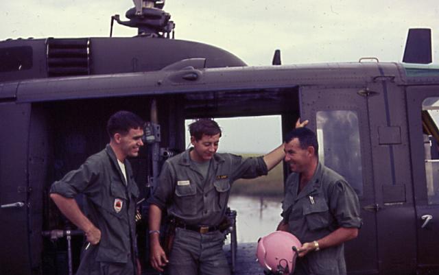 13 Chief Warrant Officer 2 Lowell L. Eneix recalls, "They had presented me with a freshly painted helmet. It was the most perfect titty pink color, they had mixed and experimented for about a week to get that color. They were proud and so was I." (Courtesy of Eneix, via VHPAMuseum.org)