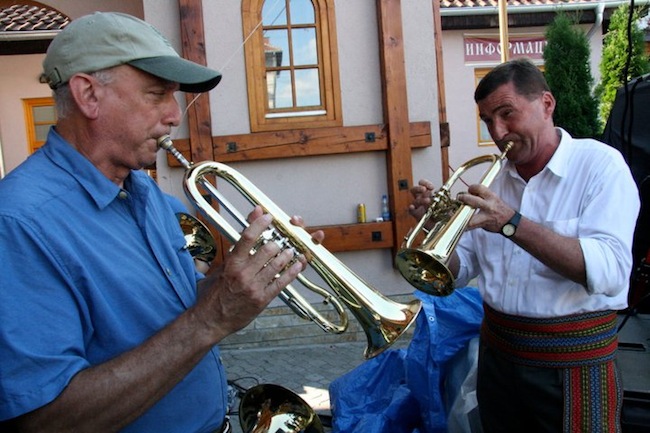 ginsburg Zlatne Uste director and co-founder Michael Ginsburg plays flugelhorn with a member of Ćerimović's band. (Via the “Brasslands” Facebook page)