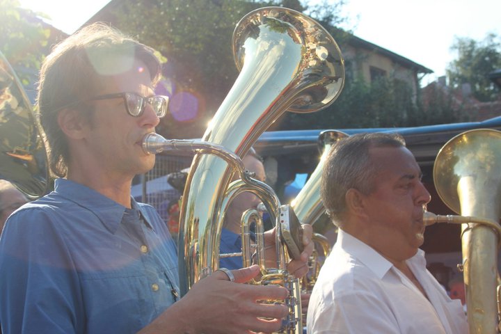 baritone Zlatne Uste baritone player Don Godwin, at left, performs in Guča's streets. (Via the “Brasslands” Facebook page)