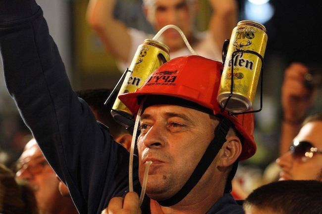 beer hat Beer drinking is a big part of the Guča festival. (Still from “Brasslands” courtesy of the Meerkat Media Collective)