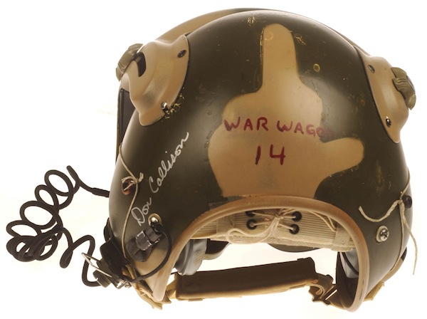 helmet2 Doug Callison traded for this dual-visor helmet with an Air Force friend, who also got it painted camouflage colors for him. The painter, "couldn’t wait to turn the helmet around to show me his handiwork on the backside. He had blended in a tan 'Bird' or 'The Finger' on the back. I was elated, to say the least! I could simply turn my head to let those next me know that they were #1 with me too." (Courtesy of Callison, restored by Don Mong, via VHPAMuseum.org)