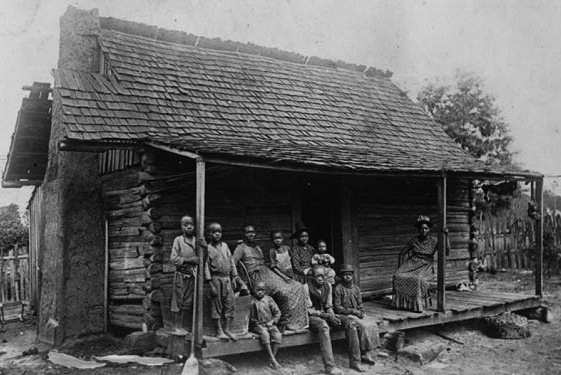 010000r A family of sharecroppers outside their cabin near Eufala, Alabama. (Via Library of Congress)