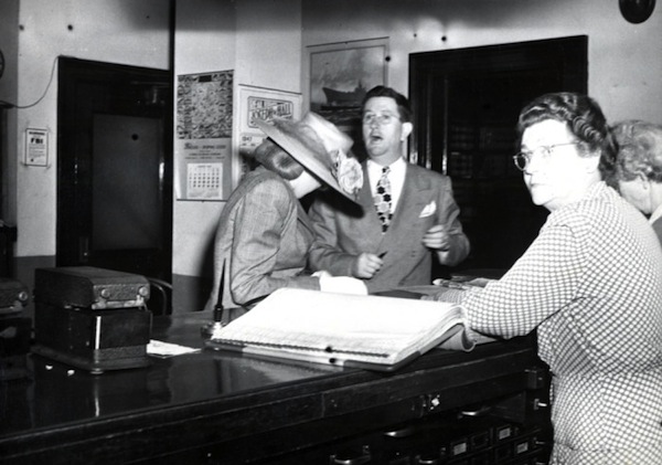 Courthouse An unidentified divorcee hides her face from a prying photographer's lens at the Washoe County Courthouse. Photo courtesy Special Collections, University of Nevada-Reno Library.