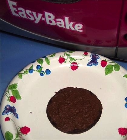 easybake_cake An Easy-Bake hockey-puck-shaped chocolate cake. (Posted by looneytunesfan on Food.com)