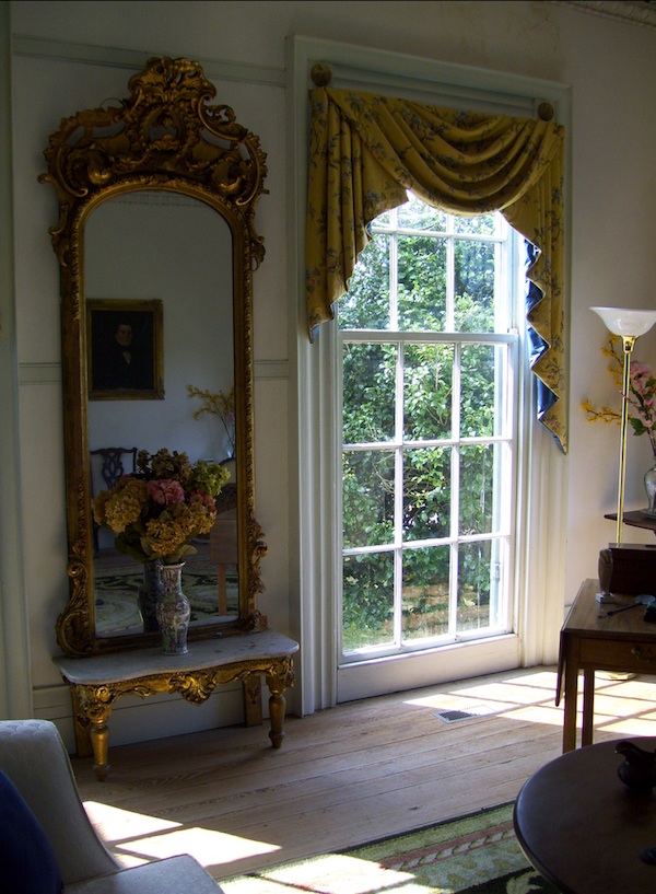 slavery_windowmirror The Buckner Hill plantation house is opulent inside and out. By 1860, the Hills owned 133 slaves who labored in their rice, cotton, and corn fields. (Photo by Arnold Modlin)