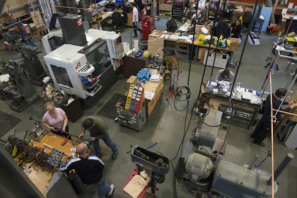 Amy Shop The Exploratorium shop: The tops of the Cleereman and DoAll are at bottom-right, while the modern gray object in the upper-left is a CNC (computer numerical control) machine. Photo, Amy Snyder.