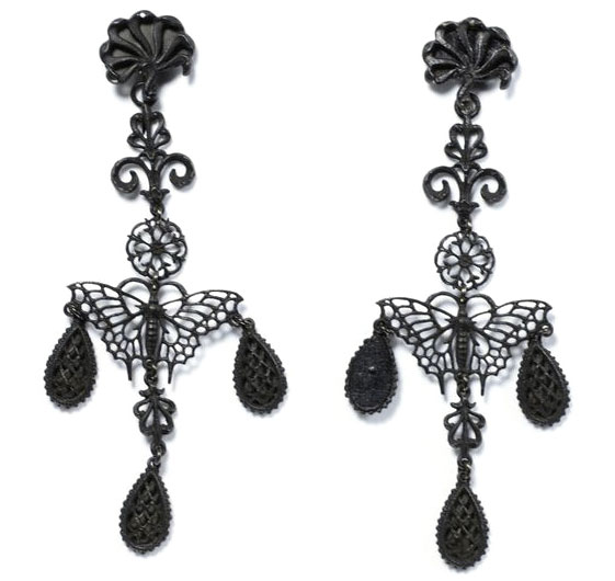 Earrings Top: This Berlin iron necklace from the early 1800s features iron cameos backed by mirrored steel. The anchors are thought to symbolize loyalty. Photo via 1stDibs. Above: These butterfly earrings were designed by Siméon Pierre Devaranne. Photo via the Victoria and Albert Museum.
