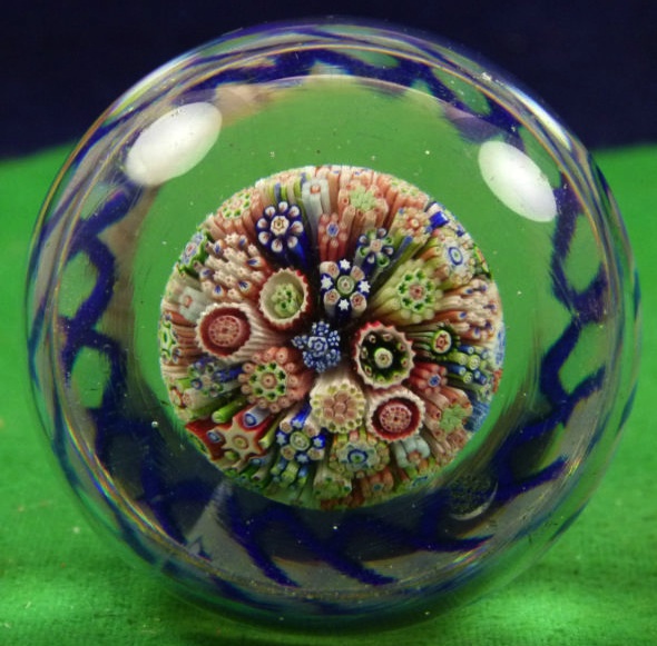 ugly_paperweight This Baccarat millefiori mushroom glass paperweight with torsade around the base is thought to be from the 1800s. The millefiori affect is created by slicing the ends of clusters of colored glass canes so viewers can see the flower-like patterns.