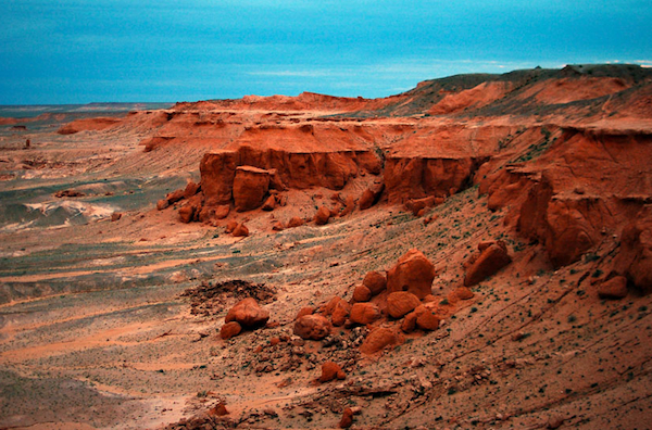 Two Years Flaming Cliffs The Flaming Cliffs of the Gobi Desert have been luring Western paleontologists since the 1920s. Photo by Kevin and Jennifer of Two Years Off.