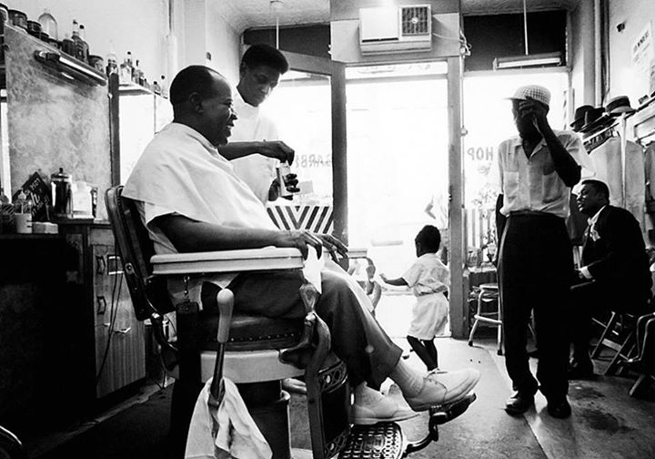 Louis Armstrong gets a haircut in his local barbershop in Queens, New York, circa 1965. Via "LIFE" Magazine.