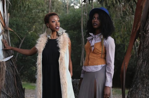 SF_drakefords2 Above: Dominique (left) and Jazmyne Drakeford model all-thrift-store looks in a redwood forest. (Photo by Pendarvis Harshaw) Top: A woman in a Goodwill dress sits on bales of unsold clothes from the thrift store. (Photo by Shidume Lozada Photography, from "Fashion & Sustainability")