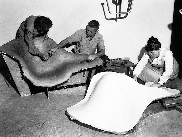 eames-chairs-5 Powerhouse Mid-Century Modern furniture designer couple Charles and Ray Eames work on some of their famous chairs. (Via Teakhound)