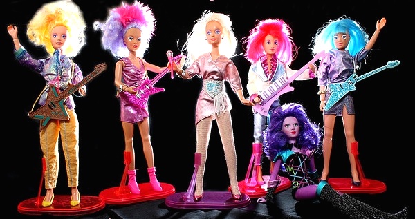 jem_dolls The original 1986 Hasbro Jem and the Holograms dolls with, from left, Video, Shana, Jem, Kimber, supercomputer Synergy, and Aja. (Via Allyeska's Flickr)