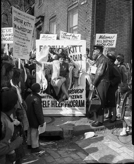 vbg_kitt_sign_carnegiemuseum In 1966, Eartha Kitt leaps through a sign in Pittsburgh, Pennsylvania, to help a program for the Citizens Committee on Hill District Renewal. (Photo by Charles "Teenie" Harris, of the "Pittsburgh Courier," via Carnegie Museum of Art)