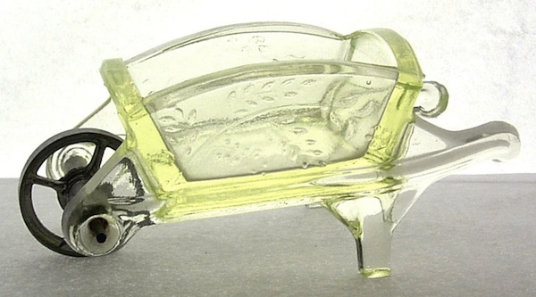 Adamswheelbarrow During the Victorian Era, glassmakers such as Adams & Co. of Pittsburgh, Pennsylvania, produced novelty items like this wheelbarrow, which could have been used as a salt or to hold matches. Photo via Dave Peterson at <a href="http://www.vaselineglass.org/">VaselineGlass.org</a>