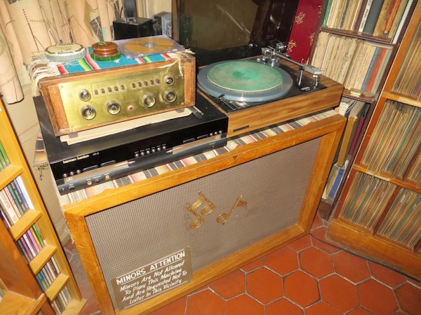 78_collector_rcrumb_turntable_heneghan28 In Crumb's record room, a sign on the speaker for his turntable reads: "Minors Are Not Allowed To Play This Machine And Are Requested Not To Loiter In This Vicinity." (Via <a href="http://www.eastriverstringband.com/radioshow/?p=1023">John's Old Time Radio Show</a>)