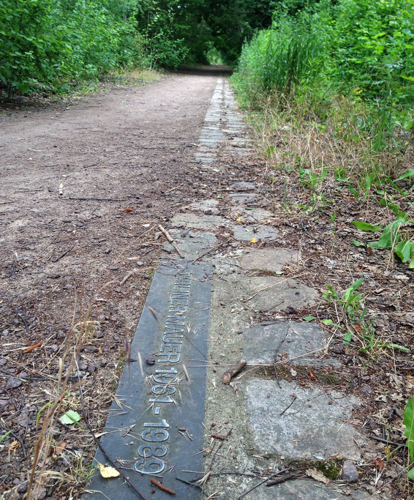 Today, the former path of the Berlin Wall's is followed by a cobblestone marker throughout the city.