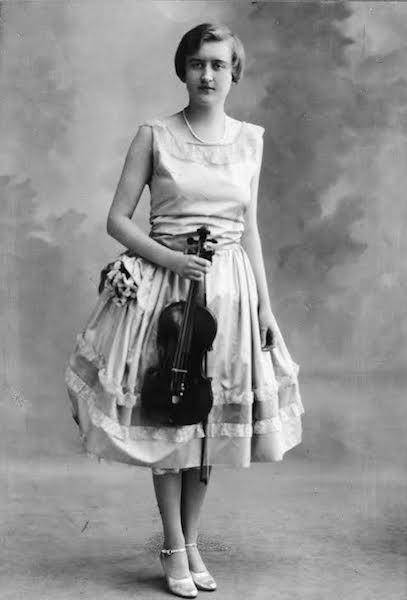 huguette_picturedwithviolin Huguette Clark was trained on the violin and, at one point, owned three instruments by Stradivari. (Estate of Huguette Clark from EmptyMansionsBook.com)