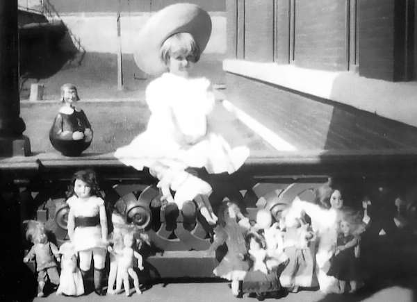 huguette_withdolls Huguette Clark poses with her dolls on the porch of the Clark mansion in Butte, Montana, circa 1910-11. (Via the collection of Paul Clark Newell, Jr., from EmptyMansionsBook.com)