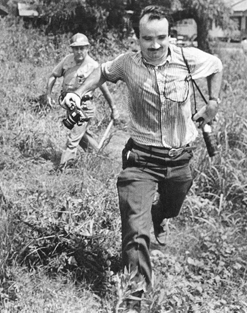 Top: Protesters at the 1963 March on Washington, captured by photographer Marion S. Trikosko. Via the Library of Congress. Above: Bob Fitch snapped this picture of a sheriff’s deputy pursuing photographer Matt Herron during a protest in Philadelphia, Mississippi, in 1966. Courtesy the <a href="http://library.stanford.edu/collections/bob-fitch-photography-archive">Bob Fitch Photography Archive</a>.
