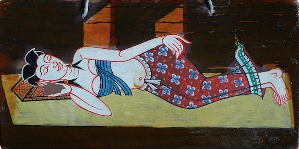 A woman sleeps on a hand-painted Do Not Disturb sign for Chaweng Resort in Koh Samui, Thailand. (Courtesy of Edoardo Flores)