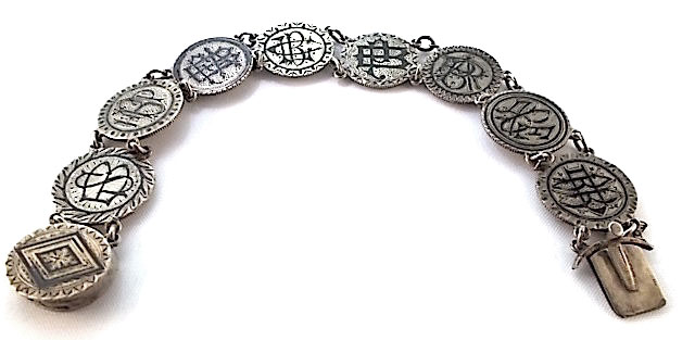 This love-token bracelet belonged to Stephanie Bougere, the widow of plantation owner Achille D. Bougere, and it features her initials, as well as those of her seven children, Horace P., Fannie A., Clarence L., Pauline, Albert R., Achille E., and Blanche D. The coins were enameled in black in mourning of her husband. (Courtesy of the Love Token Society)