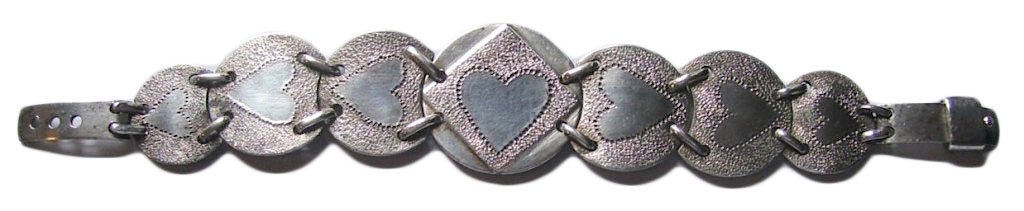 During WWII, U.S. soldiers in the Pacific Theater were paid in Australian coins, some of which they would turn into romantic jewelry, like this bracelet. (Courtesy of the Love Token Society)