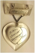 This WWII Lucite-and-love-token pendant says "New Guinea" and "To My Darling Sweetheart 1945." (Courtesy of the Love Token Society)