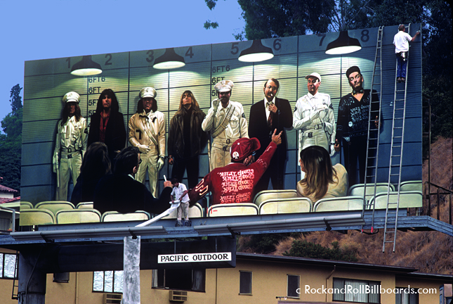 Painters put the finishing touches on a Cheap Trick billboard in 1979. Photo by Robert Landau.